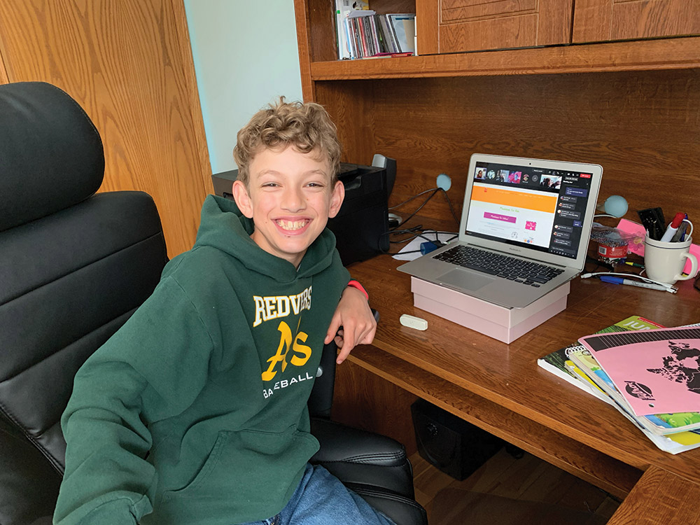 Grady Sutter takes a moment to pose for the camera during his online class.