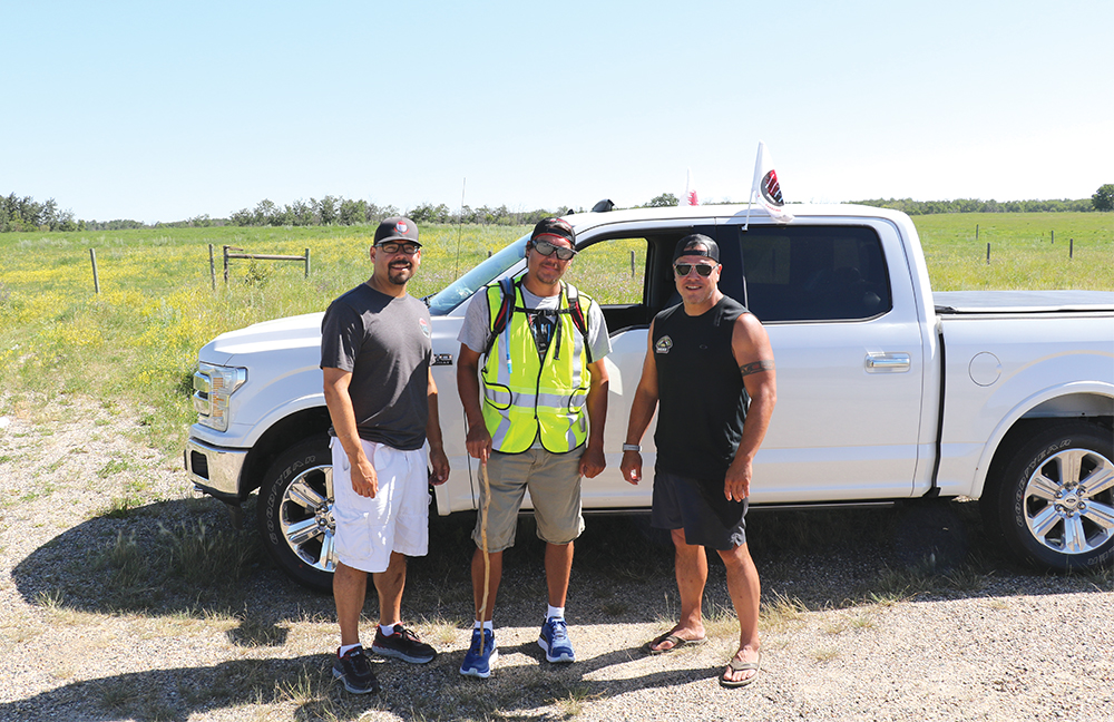 Kevin Redsky (middle) is joined by fellow police officers Mitchell Boulette (left) and Clayton Tait (right) as he makes his journey across Canada.