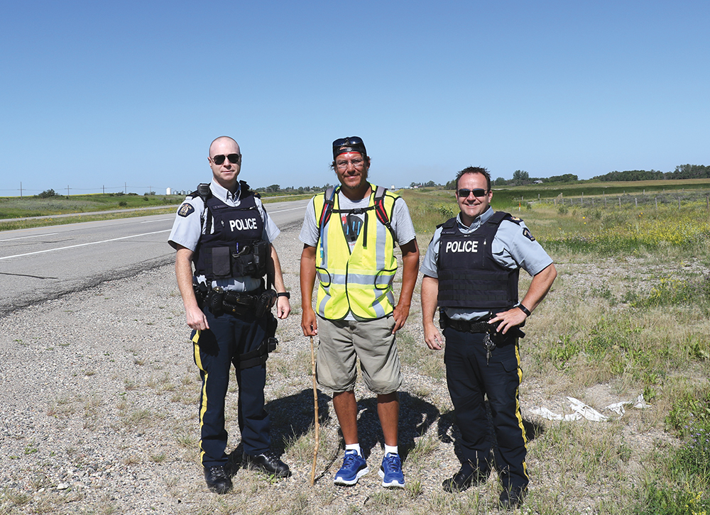 Kevin Redsky with Moosomin RCMP Corporal Damien Grouchy (left) and Sgt. Scott Fefchak (right).