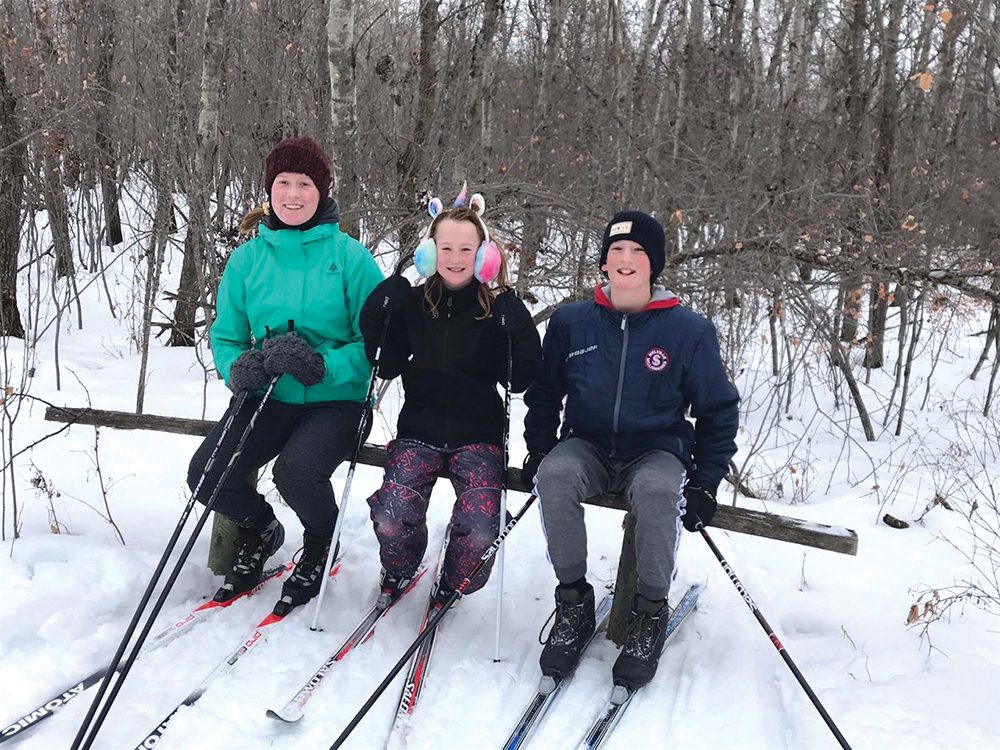 The Walker family cross-country skiing.
