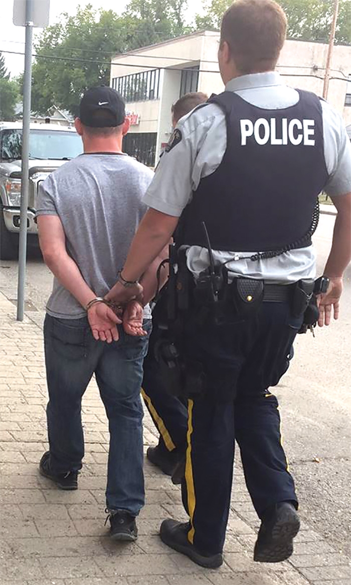 Steven Wuelfrath was arrested by Moosomin RCMP Wednesday, Sept. 13. At right, cash and a computer reported stolen were among many items retrieved by Moosomin RCMP from Wuelfraths vehicle.