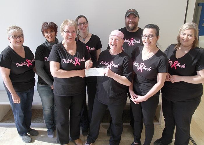 The Tickity Boob Fundraiser on March 24 in Moosomin raised $18,712.74 for Debbie Brown who is undergoing treatments for breast cancer. The proceeds of the fundraiser were presented to Debbie last week by the volunteers who helped organize the fundraiser. In back from left are Lynn Russell, Sharen Hogarth, Anna Hall and Andrew Stacey. In front are Marlyne Primrose presenting a cheque for $18,712.74 to Debbie Brown. At right are Mona Windrim and Kim Dawson.