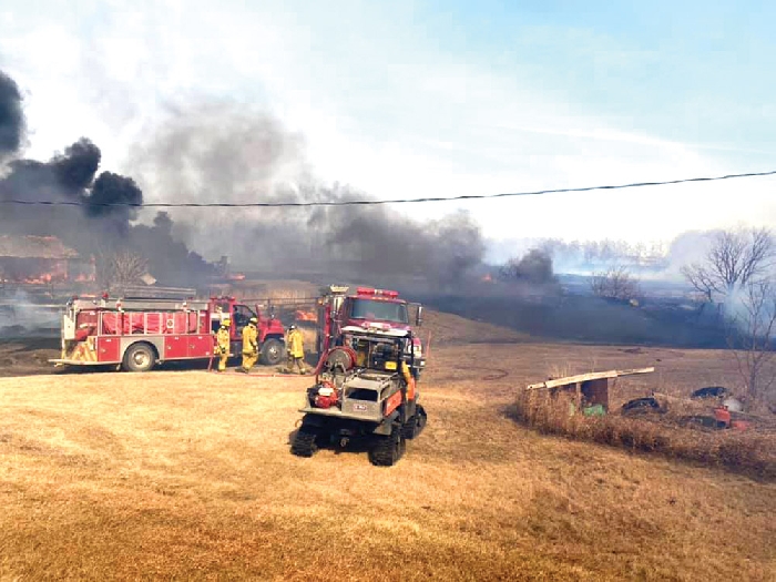 Firefighters from Virden, Elkhorn and McAuley worked together to fight a grass fire last week and were able to save a house, however several buildings were lost in the blaze.