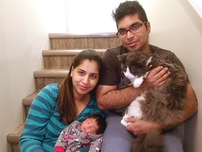 Rayaan Bawa is the first baby born to a Moosomin couple in 2018, at 1:15 in the morning on New Years Day. He was born to Mehak and Abhinav Bawa. Above is the couple with their new baby and their cat Romeo.