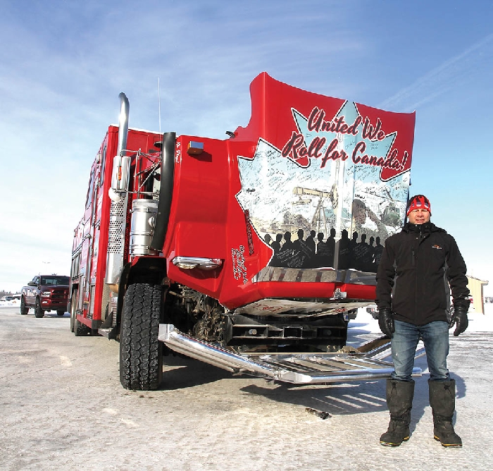 Organizer Glen Carritt of the United We Roll convoy to Ottawa stopped in Moosomin Friday. He was collecting signatures on the hood of his truck along the way. See page 4 for more photos.