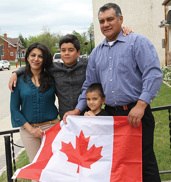 Moosomins Santos family the day they were allowed to remain in Canada.