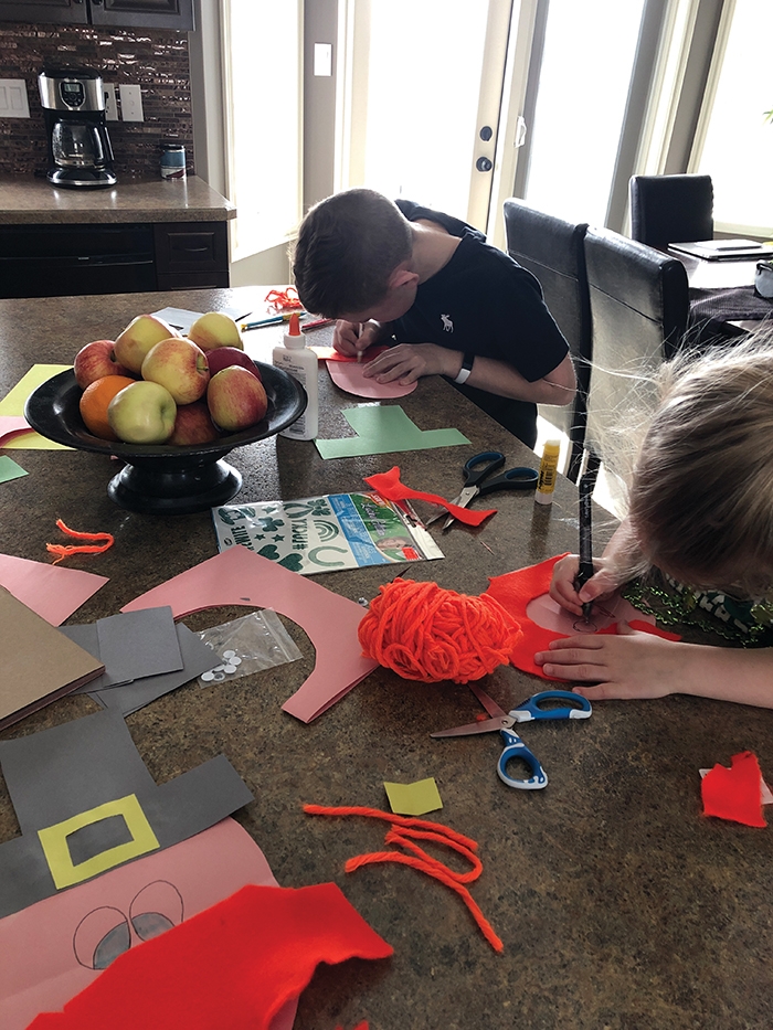 Kim Setrums children, Maddex and Prezley working on assignments and making St. Patricks Day crafts.