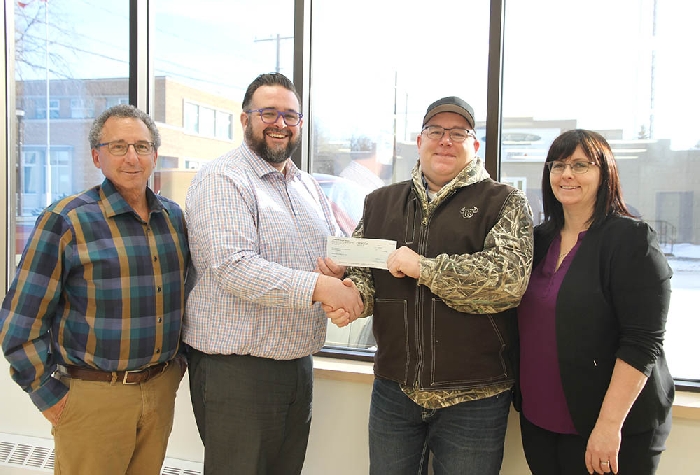 <b>$100,000 from Conexus for airport</b><br> Conexus Credit Union presented a cheque for $100,000 last week for the expansion of Moosomins airport to accommodate the Saskatchewan Air Ambulance. From left are Jeff St. Onge of the airport planning committee, Conexus Moosomin Branch Manager Brandon Carter, RM of Moosomin Reeve David Moffatt and RM of Moosomin administrator Kendra Lawrence.