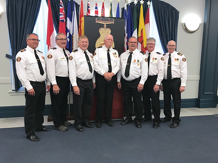 Seven members of the Moosomin Fire Department were presented with the Saskatchewan Protective Services Medal at Government House in Regina last week. From left are Fire Chief Rob Hanson, Jack Thompson, Greg Nosterud, Robert Moran, Joe Matichuk, Richard Hogarth and Deputy Fire Chief Mike Cooper.