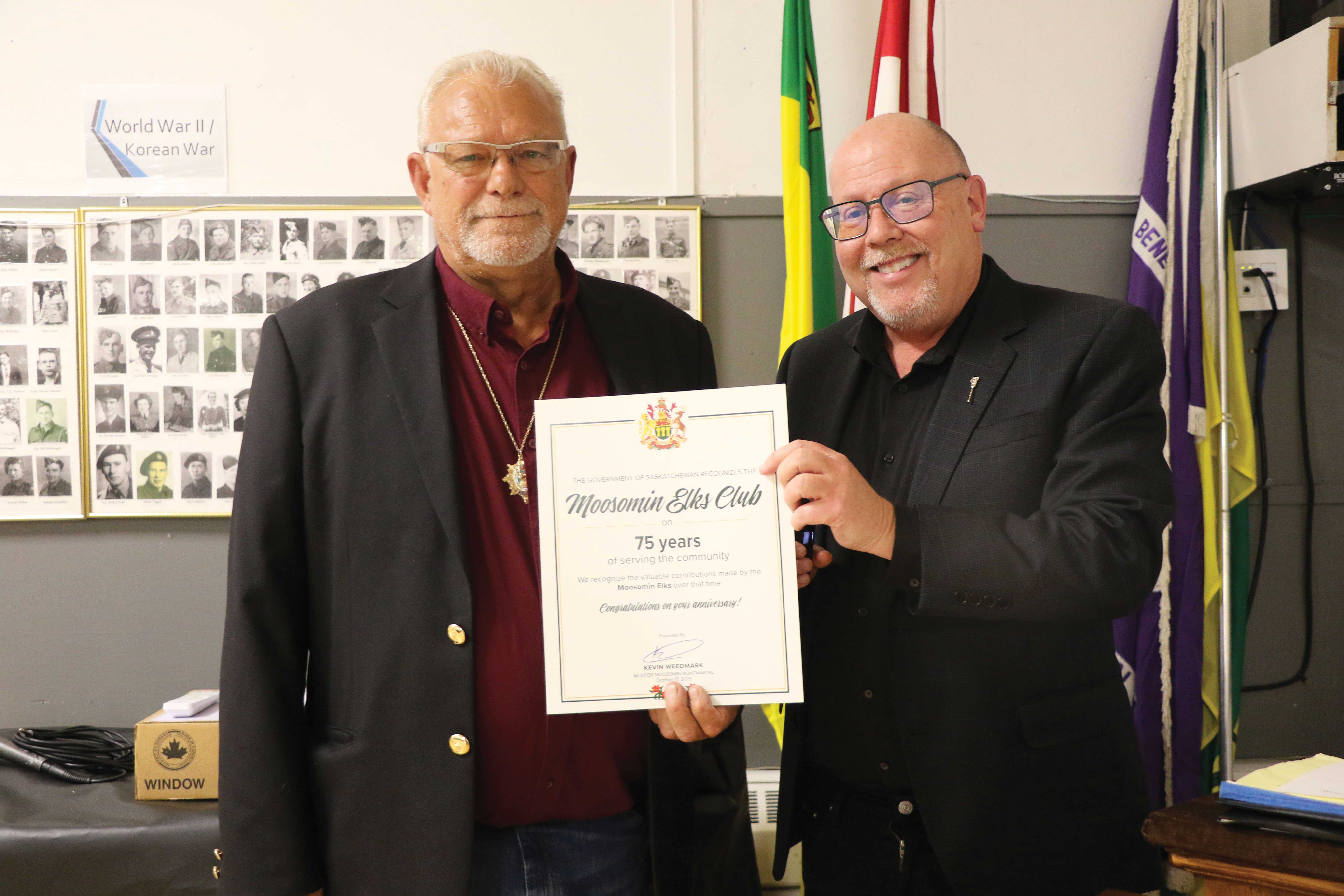 Moosomin-Montmartre MLA Kevin Weedmark congratulating Moosomin Elks President Ron Potter on the Moosomin Elks 75th anniversary.