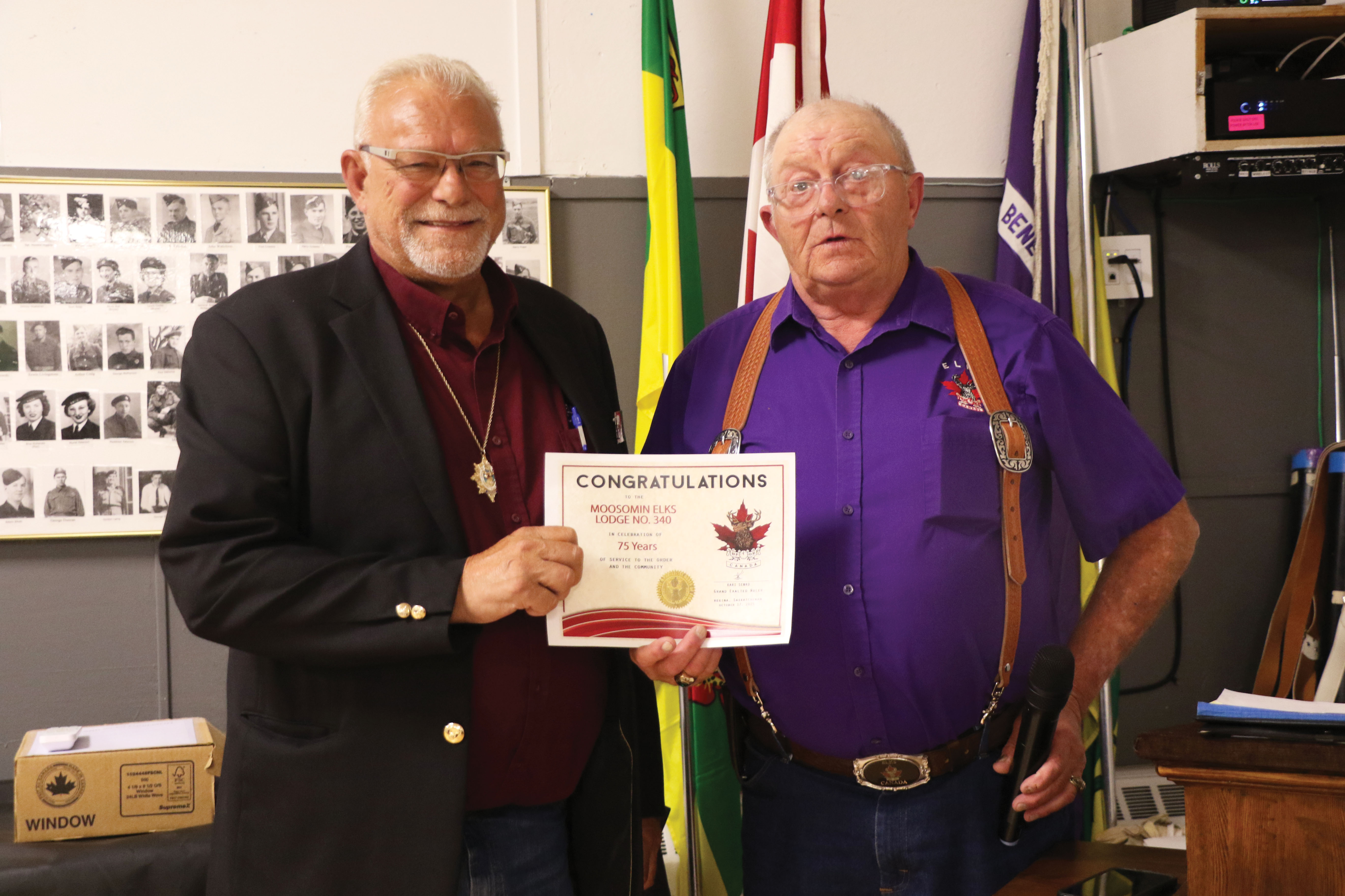 Grand Lodge representative Eugene Hartter from Wilkie congratulating Moosomin Elks President Ron Potter on the Moosomin Elks 75th anniversary.