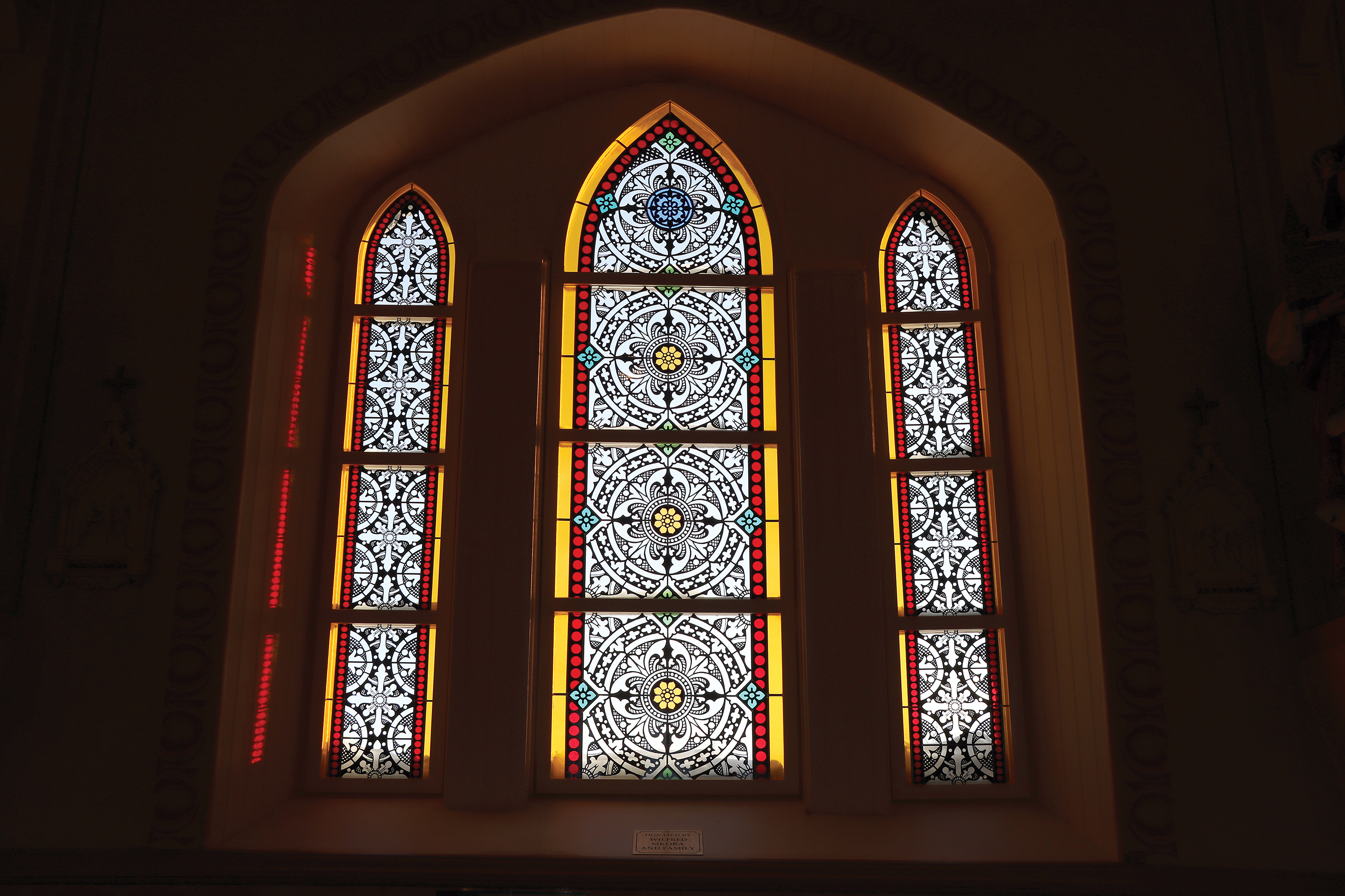 The stained glass windows at Kaposvar Church. The Hungarian embassy donated $40,000 toward four banks of new stained glass windows at the church.
