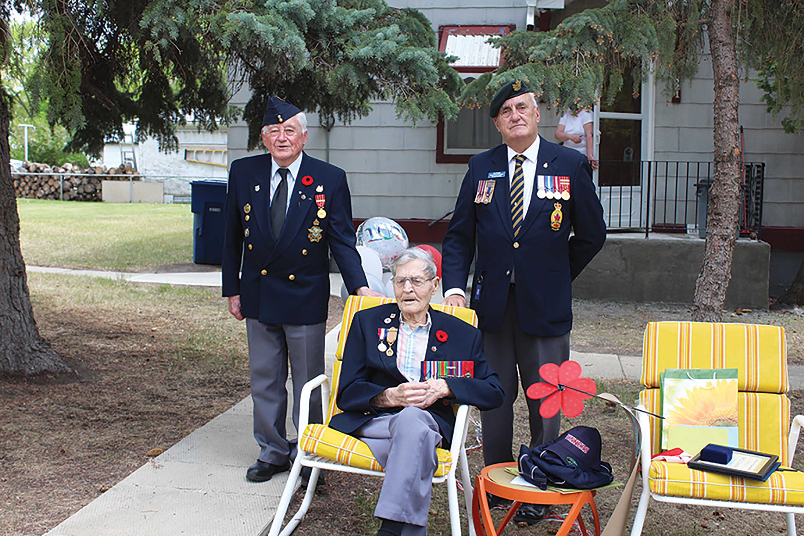John Fefchak, left, a military veteran and caregiver to Les, center, and Captain Kelvon Smith, a long-time Virden educator. Smith was a major organizer of the  birthday parade for Les, along with Fefchak.<br />
