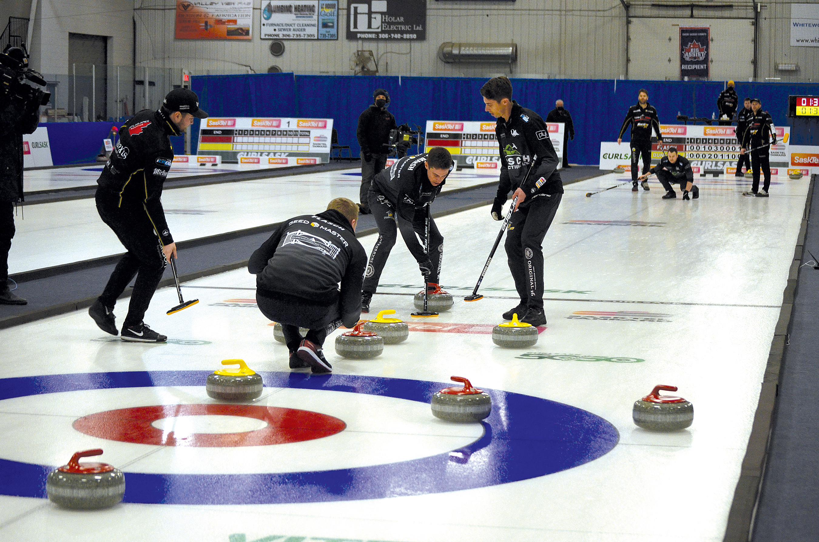 Skip Colton Flasch watches carefully after his third, Catlin Schneider, throws his rock in what was a close final game during the SaskTel Tankard in Whitewood Feb. 13. Sweeping Schneider’s rock were Flasch’s lead and second, Kevin Marsh and Daniel Marsh.