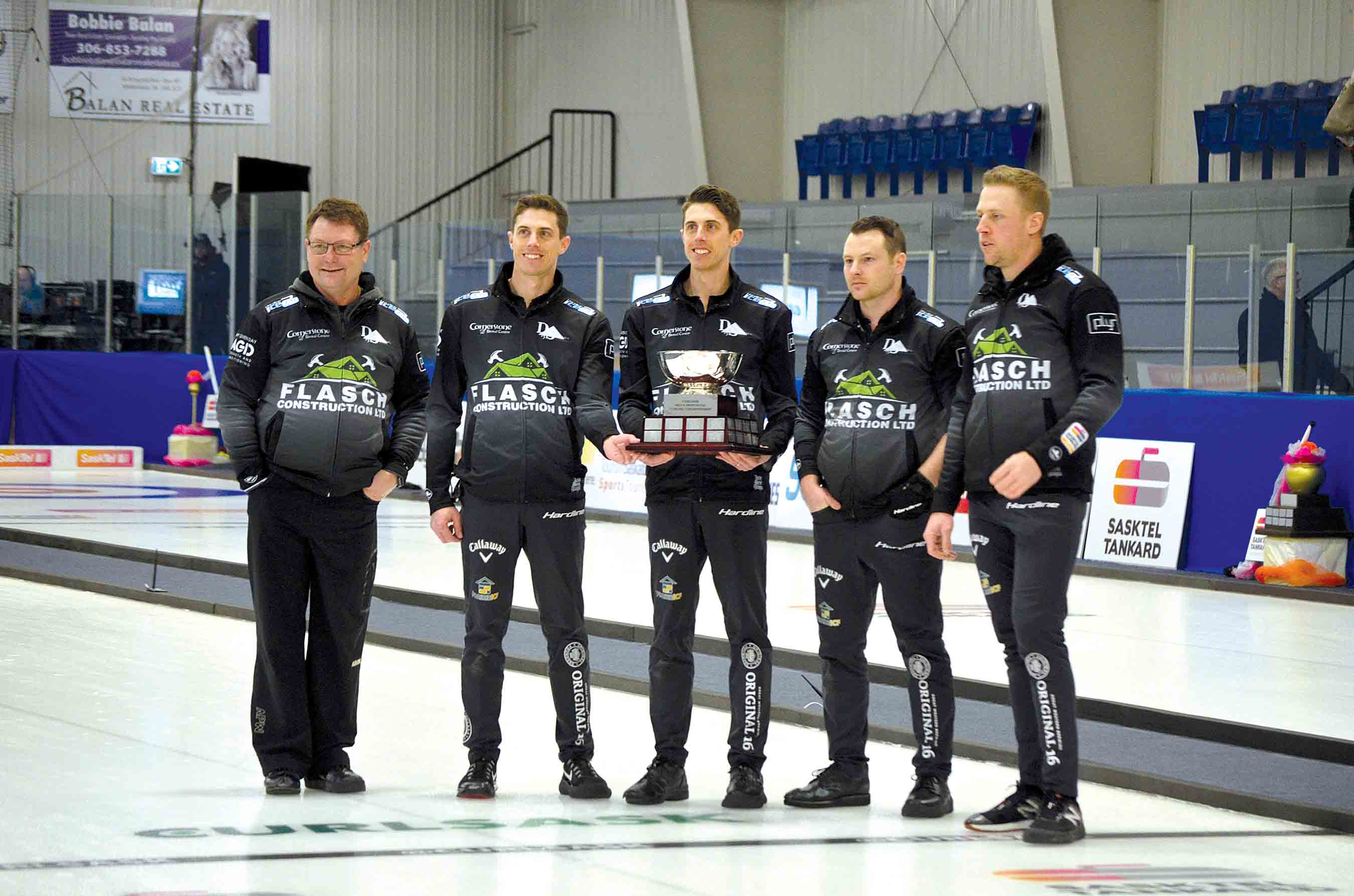 Holding the Tankard trophy after their win in Whitewood on Feb. 13 were members of Team Flasch. From left are Coach Jamie Schneider, Lead Daniel Marsh, Second Kevin Marsh, Third Catlin Schneider, and Skip Colton Flash.