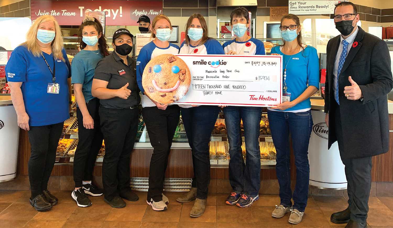 Tim Hortons Moosomin presented a cheque for $15,934 to Moosomin Long-Term care last week. The cheque represents the proceeds of the 2021 Smile Cookie campaign in Moosomin. It is a record amount raised in Moosomin, and in the top three in Saskatchewan for funds raised this year. At right is Greg Crisanti (Westman Tim Hortons manager). From left are Karen Holloway (recreation worker), Jenna Grose (resident care coordinator), Cherrie Caliwag (Moosomin Tim Hortons manager), Amber Szafron-Campbell (recreation worker), Sara Gustafson (recreation coordinator), Coleen Webb (recreation worker) and Br