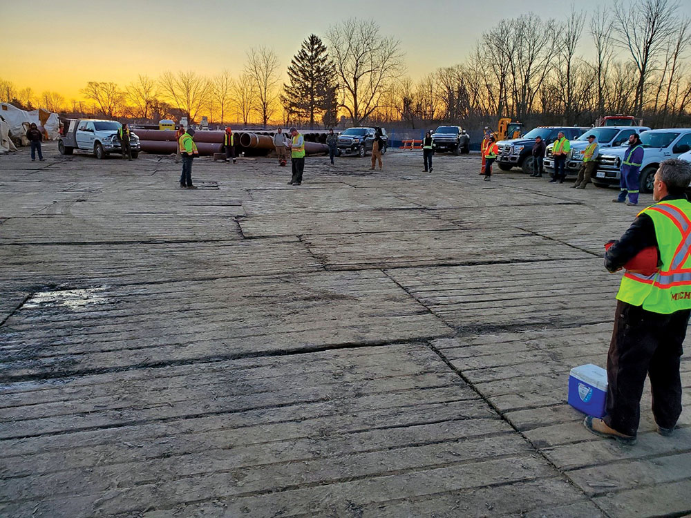 An Enbridge morning meeting with employees practising social distancing