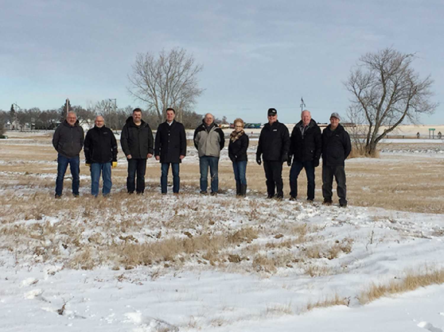 Grenfell Mayor Rod Wolfe (third from left), Moosomin MLA Steven Bonk (fourth from left), and members of the Grenfell & District Health Foundation stand at the future site of a 33-bed facility that will replace the Grenfell Pioneer Home.
