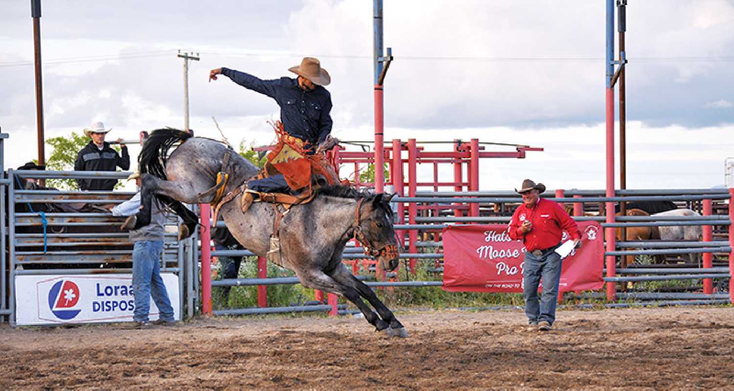 A saddle bronc rider at the Moose Mountain Pro Rodeo in Kennedy, in July 2022.  Photo by Grace Deptuck.