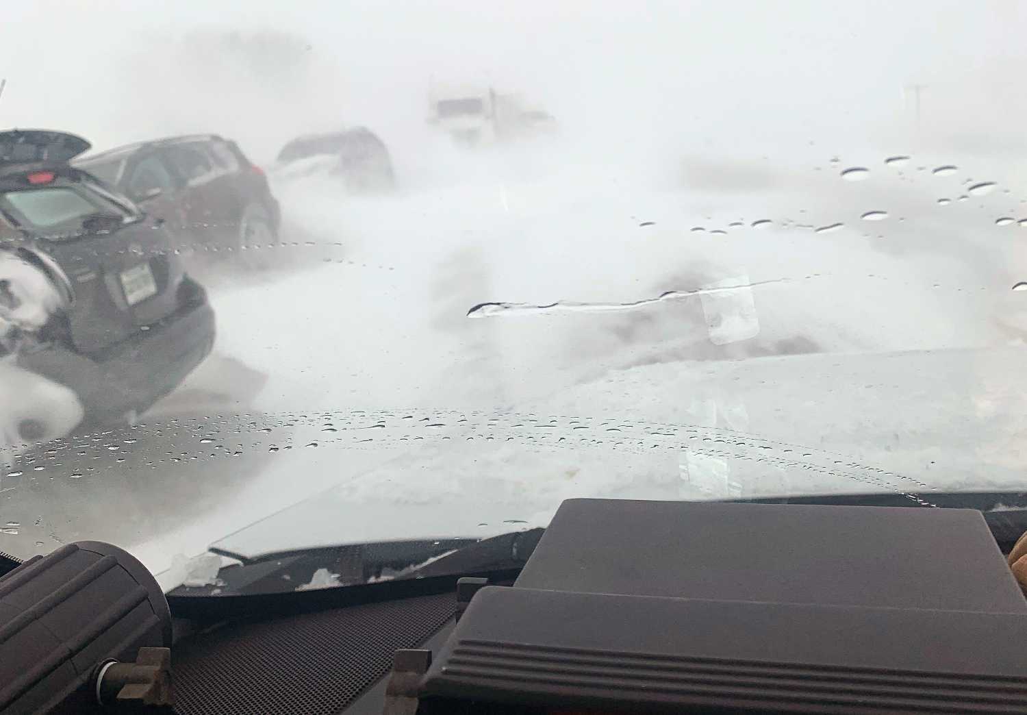 The view from an RCMP vehicle as hundreds of vehicles were stuck in a blizzard on the Trans-Canada Highway
