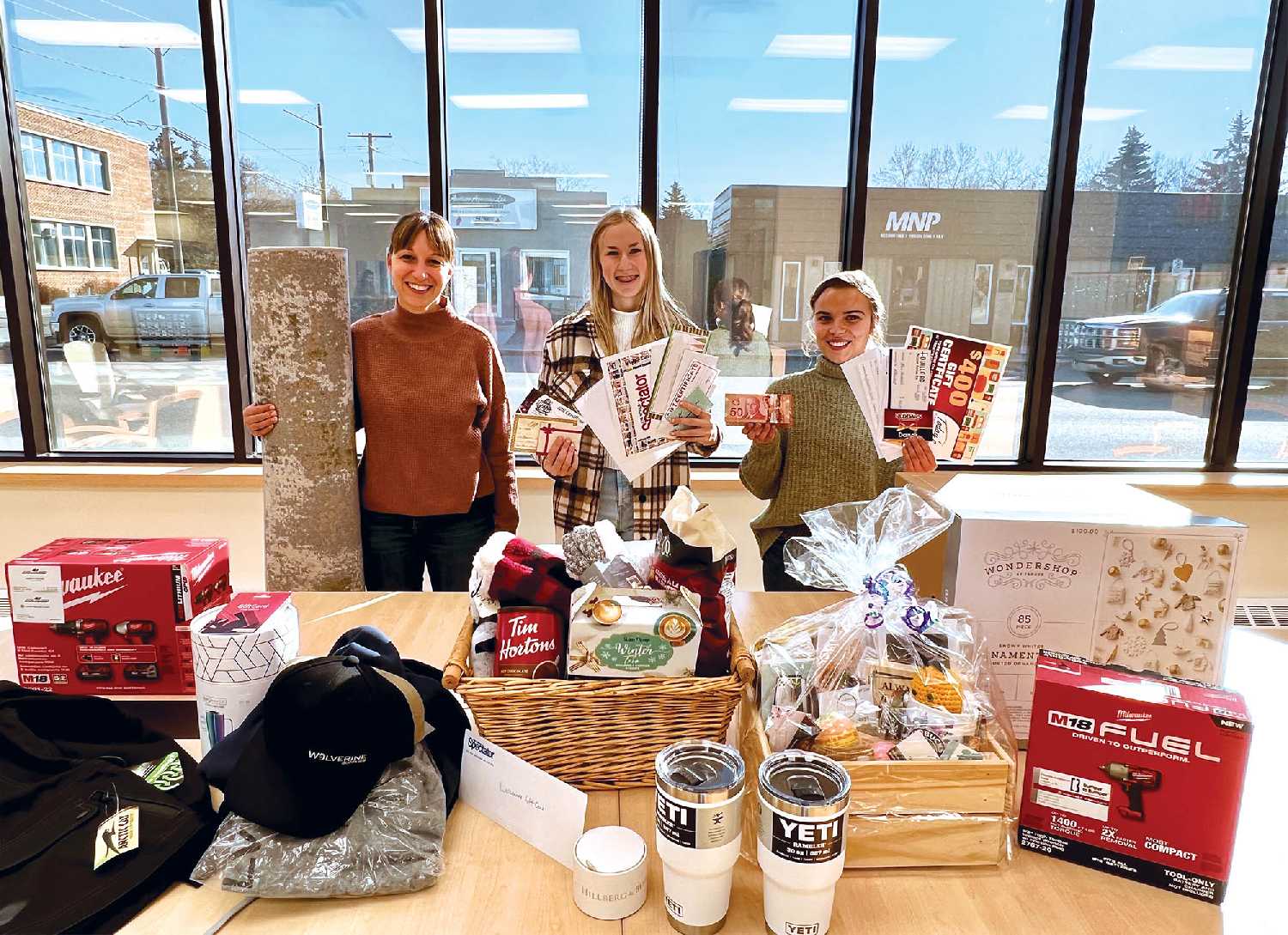<b>Lots of prizes to give away</b> World-Spectator advertising staff Kara Kinna, Ashley Bochek and Sunnette Kamffer with some of the 55 secondary prizes that are being given away in the World-Spectator’s $15,000 Christmas Giveaway.