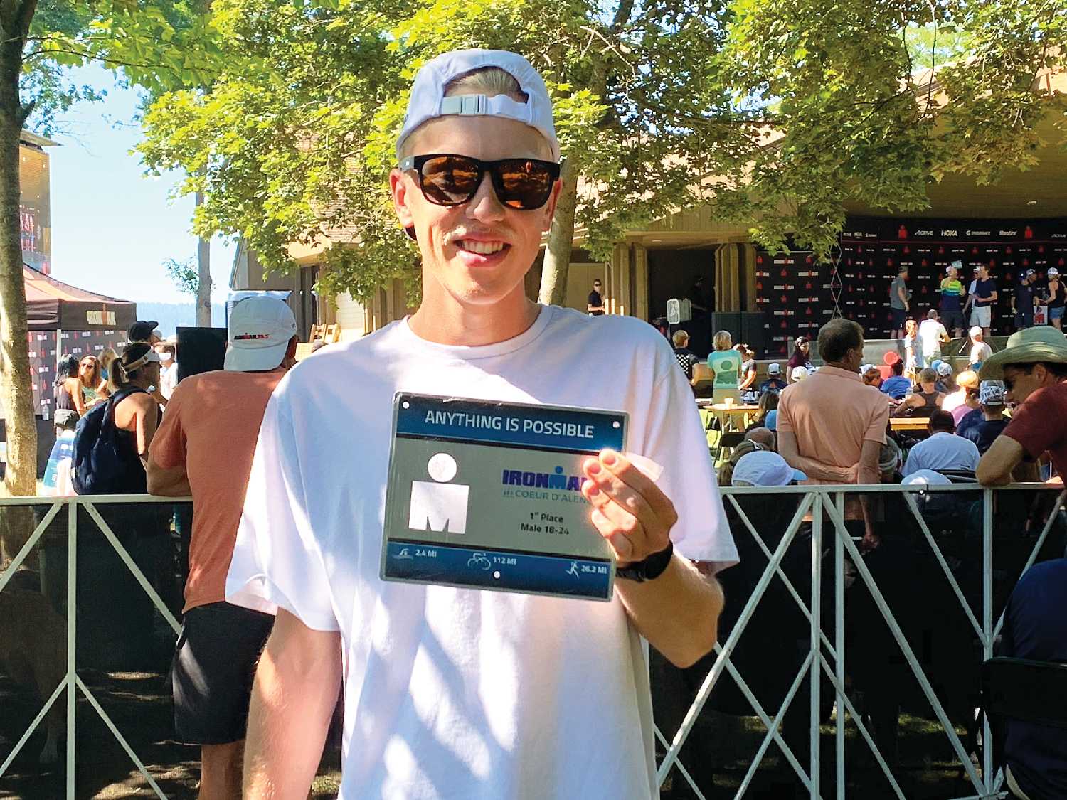 Jameson Plewes with a plaque for his first place finish at a half Iron Man race in Coeur dAlene, Idaho this year.