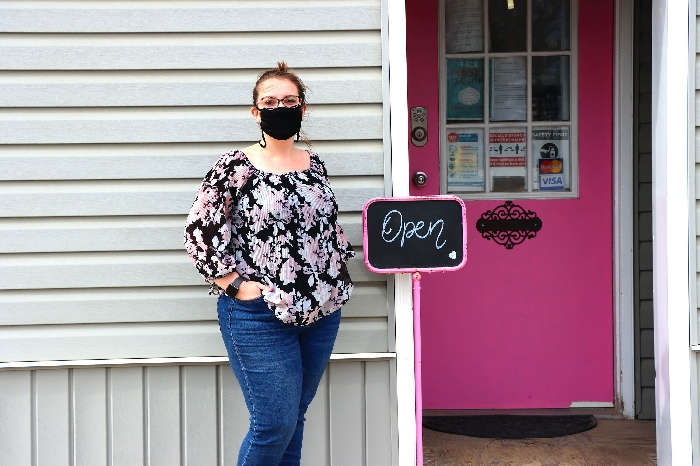 Samantha Cluett, owner of Samanthas Boutique in Elkhorn, Manitoba, has been able to keep her doors open with a limited capacity through the new Covid-19 restrictions put in place by the government of Manitoba.
