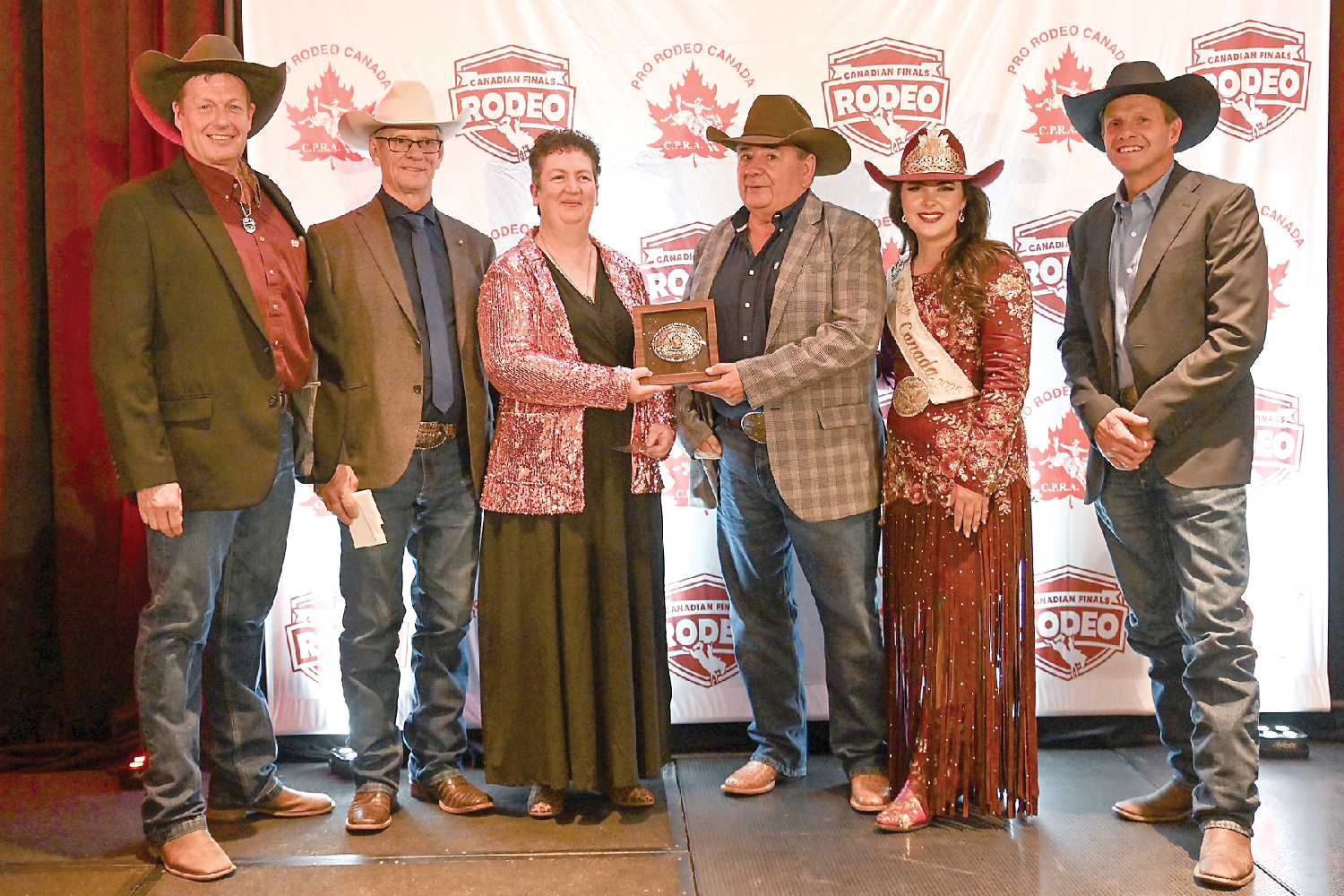 From left: Shane Crouch, Lloyd Gray (CPRA office), Jill Lowe, Vern McDonald (C5 Rodeo Buckle Sponsor), Miss Rodeo Canada Codi Wilson, and Travis Whiteside (President CPRA).