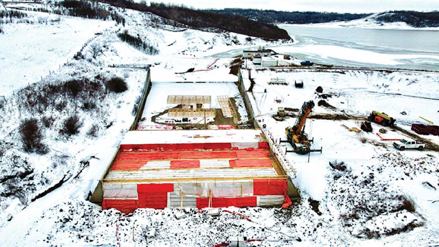 Work continues on Moosomin Dam and there are warnings of thin ice on the lake while construction continues.