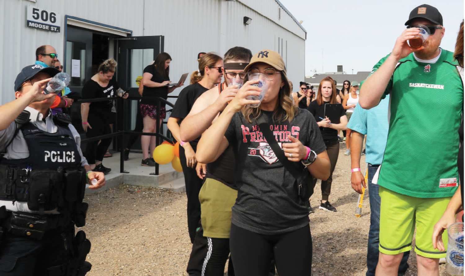 People chugging their beers at the start of last year�s beer mile.