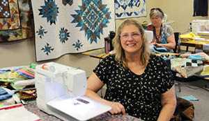 Local women sewing quilts for Jasper